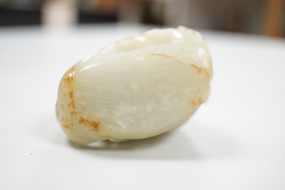 A Chinese pale celadon jade 'deer' pebble carving, 7cm high